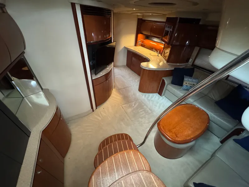 Slide: The Image of Luxurious interior of 2003 Sea Ray 500 Sundancer yacht with plush seating and modern amenities. - 17