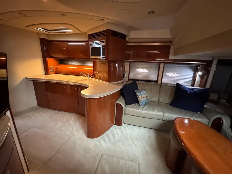 Slide: The Image of Luxurious interior of 2003 Sea Ray 500 Sundancer yacht with elegant wood finishes. - 19