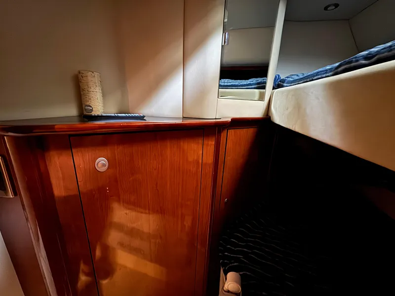 Slide: The Image of Interior hallway of 2003 Sea Ray 500 Sundancer yacht with wooden doors and cozy lighting. - 26