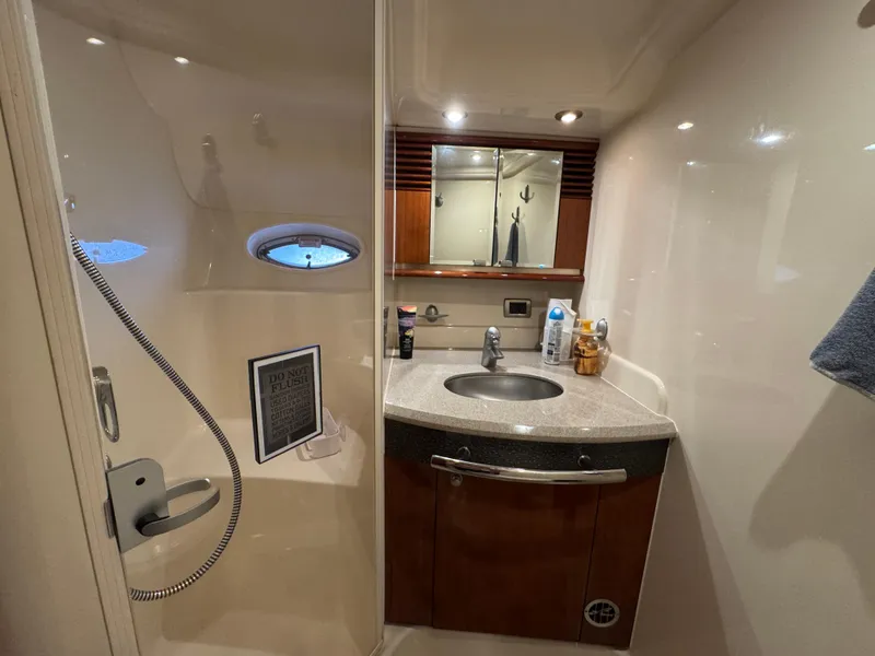 Slide: The Image of Bathroom interior of 2003 Sea Ray 500 Sundancer yacht, featuring sink and toilet. - 29