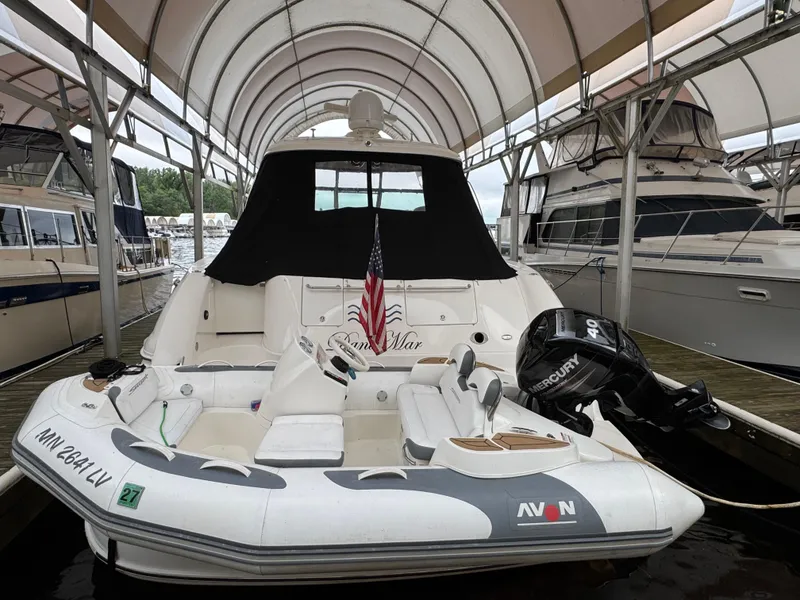 Slide: The Image of 2003 Sea Ray 500 Sundancer yacht docked under a canopy. - 4