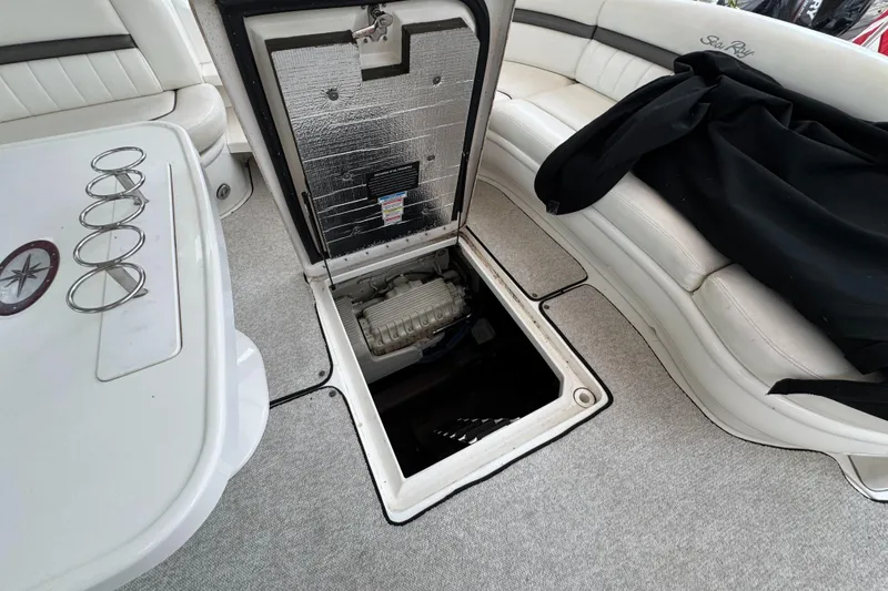 Slide: The Image of Luxurious interior of 2003 Sea Ray 500 Sundancer yacht with plush seating and elegant wood table. - 46