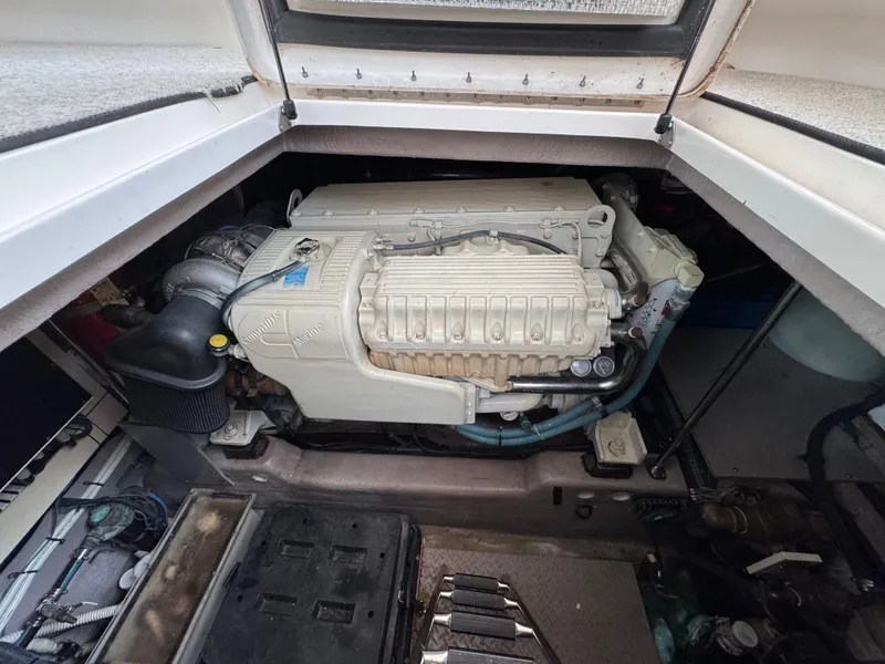 Slide: The Image of 2003 Sea Ray 500 Sundancer interior with built-in washer under wooden stairs. - 47