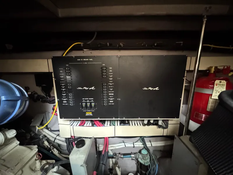 Slide: The Image of Engine compartment of a 2003 Sea Ray 500 Sundancer boat, showing detailed components and wiring. - 50