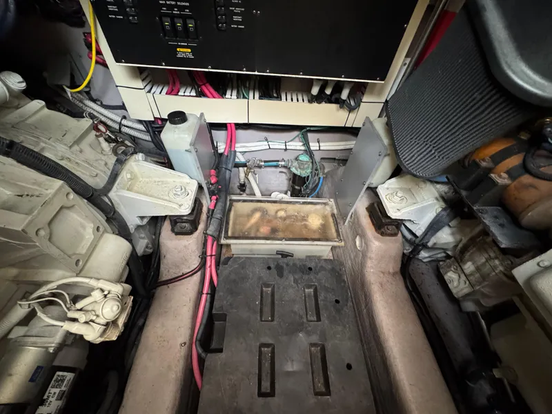 Slide: The Image of Engine room of 2003 Sea Ray 500 Sundancer with control panel and mechanical components. - 51