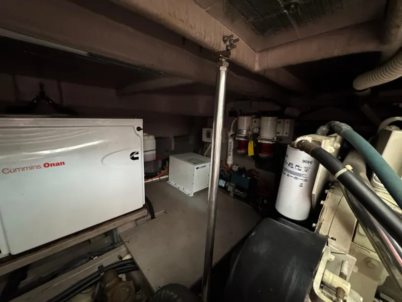 Slide: The Image of Engine room of a 2003 Sea Ray 500 Sundancer with visible components and wiring. - 53