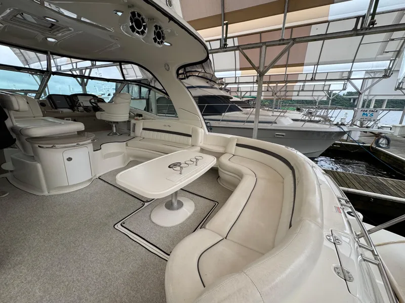 Slide: The Image of 2003 Sea Ray 500 Sundancer yacht docked under a covered marina. - 6