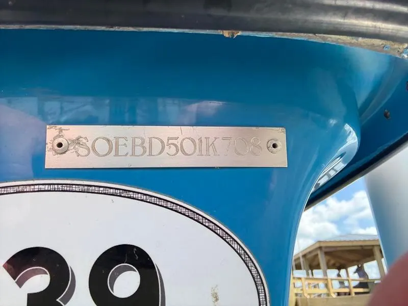 Slide: The Image of Close-up of a blue Sterling 180TS 2008 with a metal identification plate. - 16