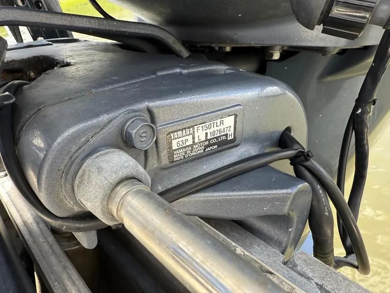 Slide: The Image of Close-up of a Yamaha F150TLR engine part on a 2008 Sterling 180TS boat. - 18