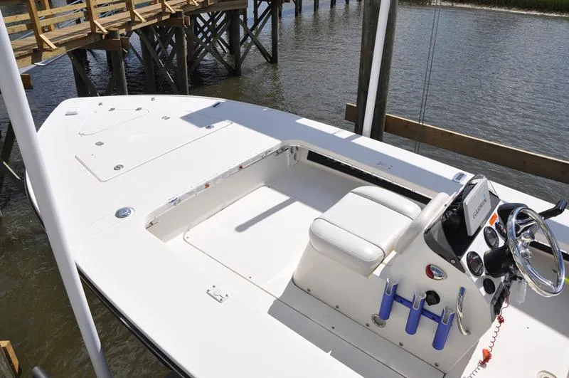 Slide: The Image of 2008 Sterling 180TS boat with white deck and steering console, docked by wooden pier. - 3