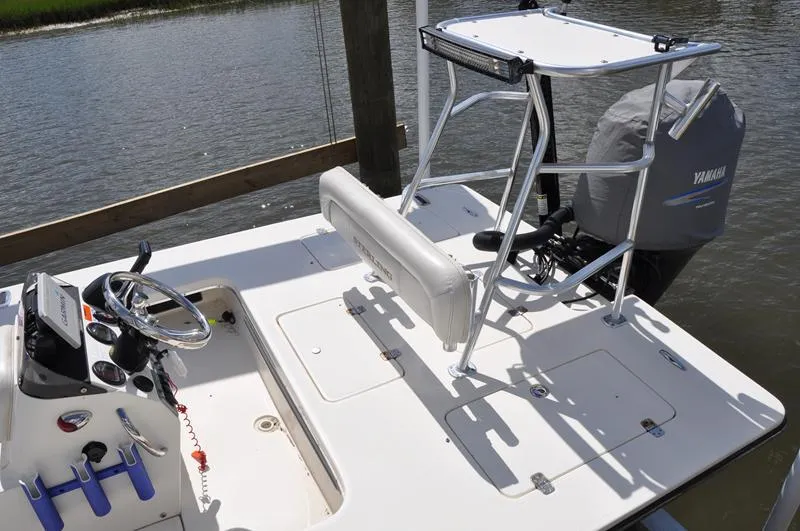 Slide: The Image of 2008 Sterling 180TS boat with Yamaha outboard motor, docked on calm water. - 4