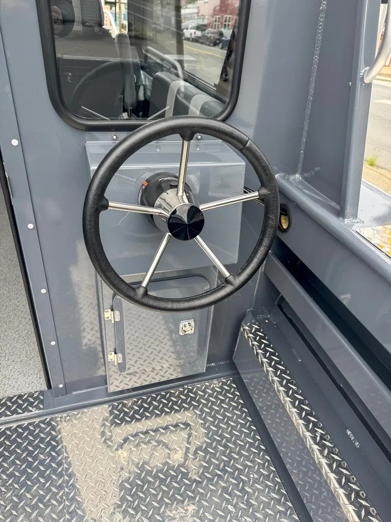 Slide: The Image of 2024 Hewescraft 220 Ocean Pro ET HT steering wheel and interior details. - 11