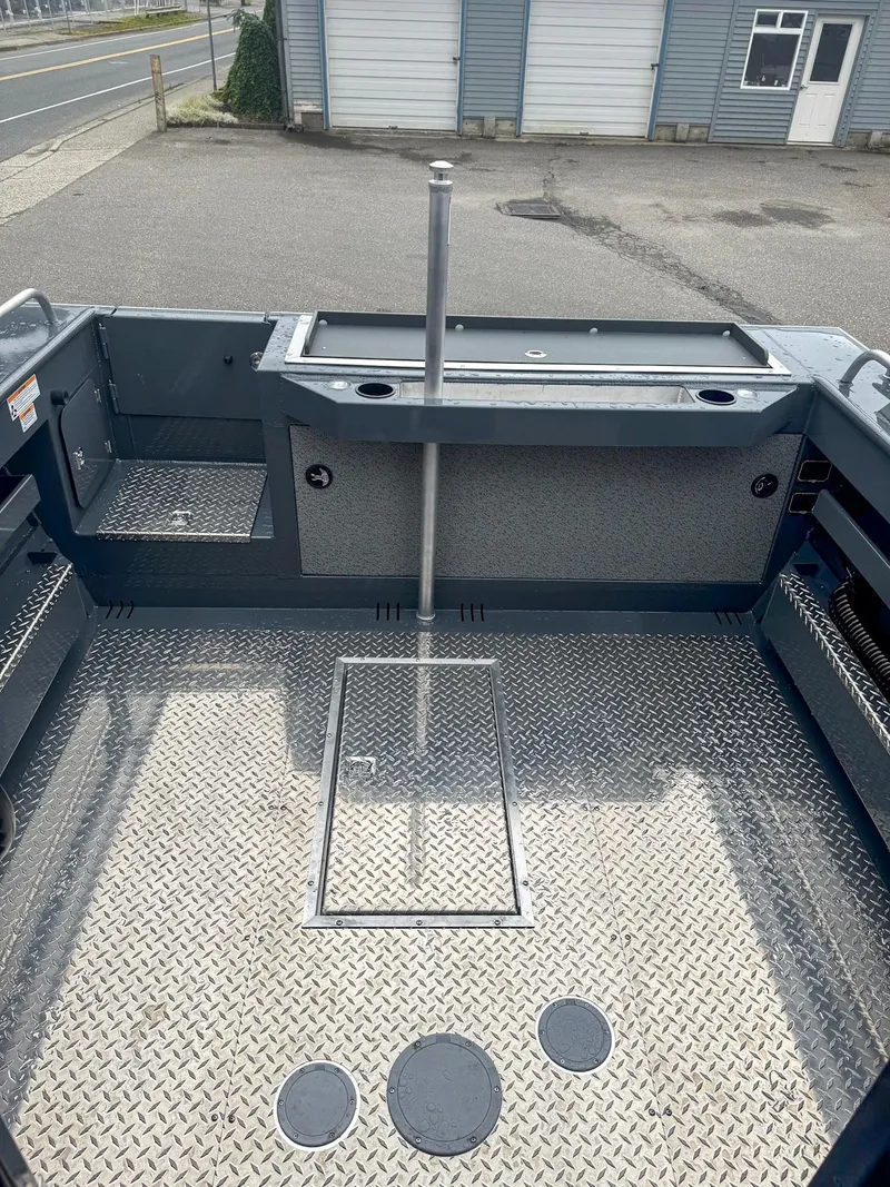 Slide: The Image of 2024 Hewescraft 220 Ocean Pro ET HT boat deck with diamond plate flooring. - 12