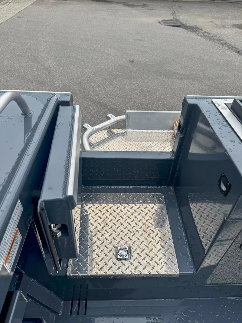 Slide: The Image of 2024 Hewescraft 220 Ocean Pro ET HT boat deck with diamond plate flooring. - 13