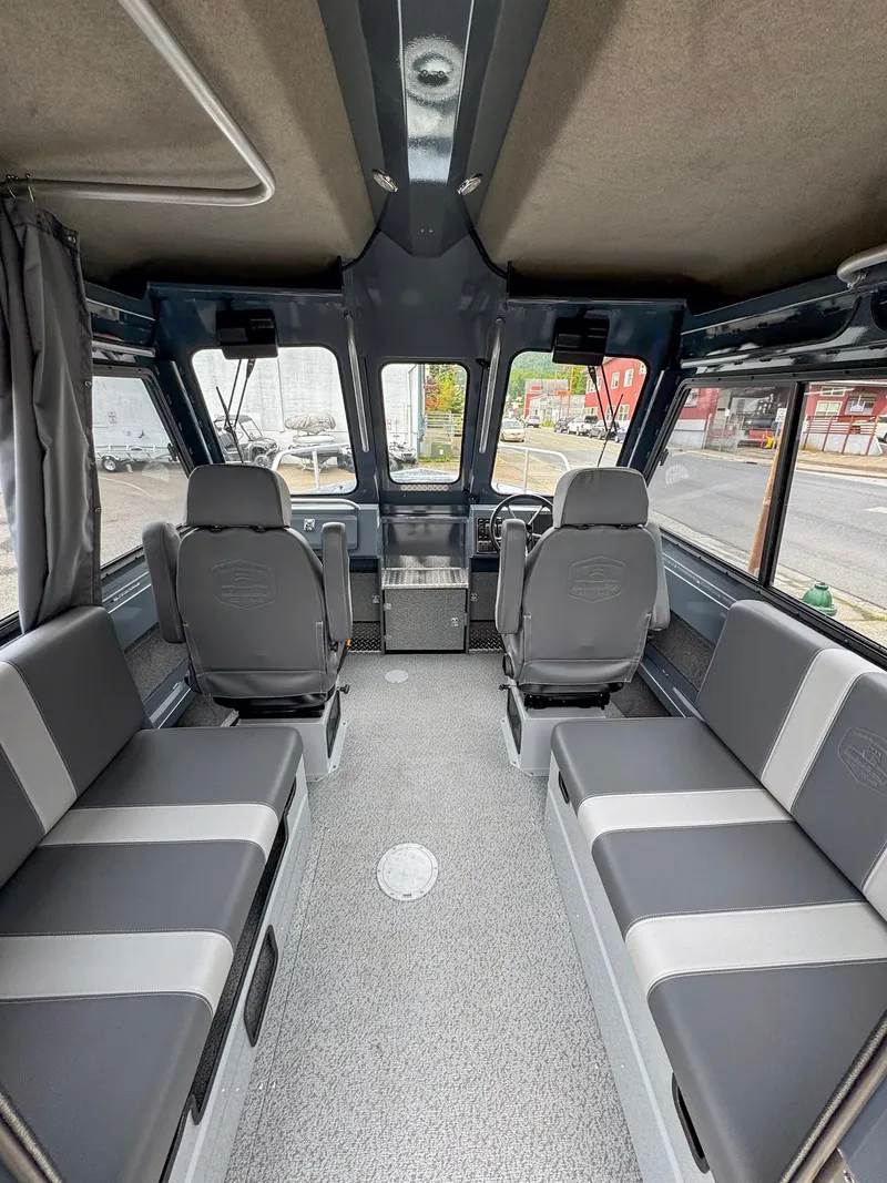 Slide: The Image of 2024 Hewescraft 220 Ocean Pro ET HT interior with seating and helm, showcasing spacious design. - 4