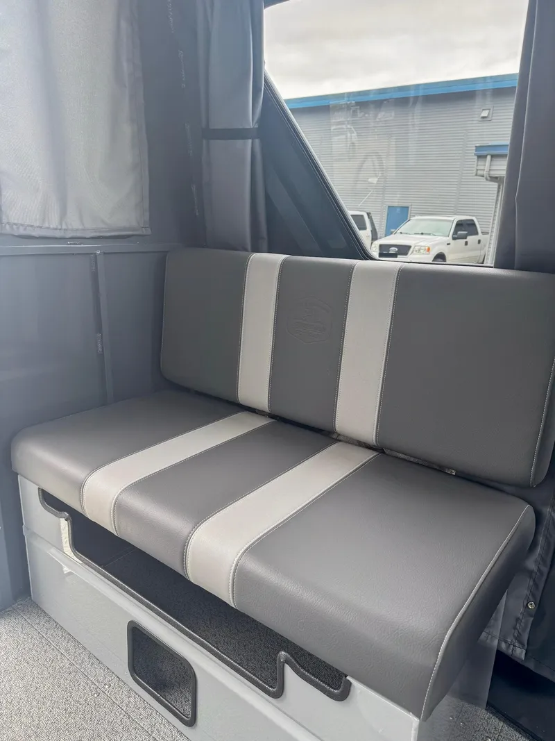 Slide: The Image of 2024 Hewescraft 220 Ocean Pro ET HT interior seating, gray and white upholstery. - 8