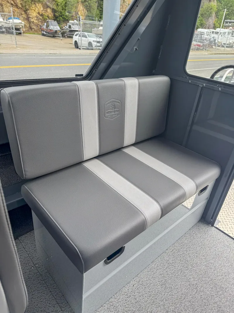 Slide: The Image of 2024 Hewescraft 220 Ocean Pro ET HT interior seat, gray upholstery, modern design. - 9