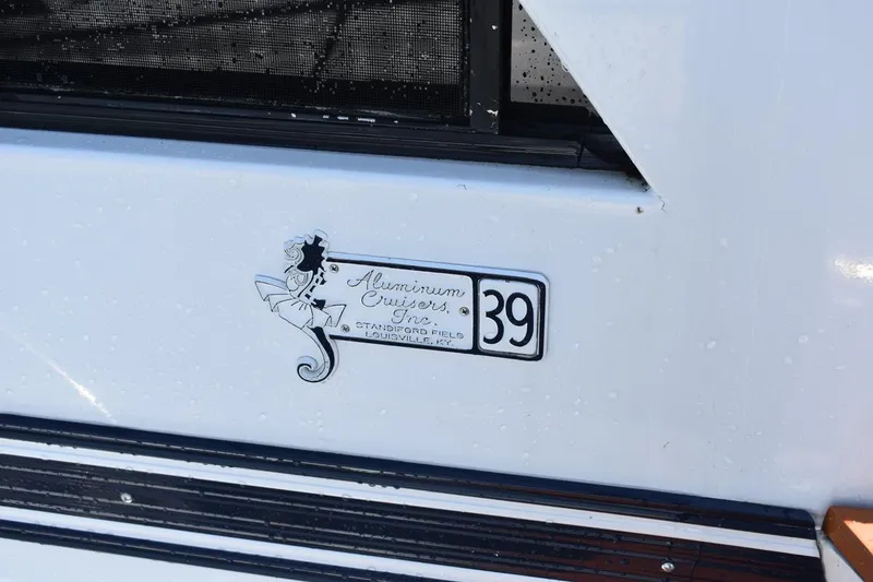 Slide: The Image of 1985 Marinette 39 Double Cabin boat emblem with vintage design and logo. - 11