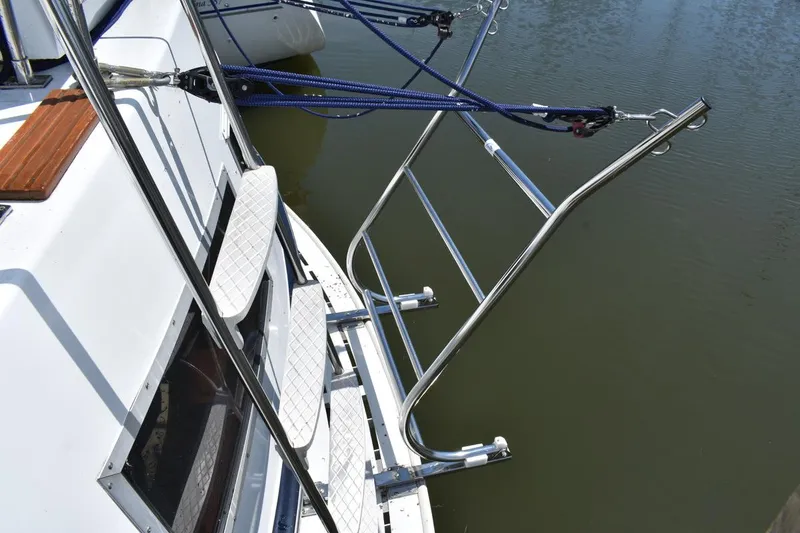 Slide: The Image of 1985 Marinette 39 Double Cabin boat with stainless steel ladder and deck details. - 14