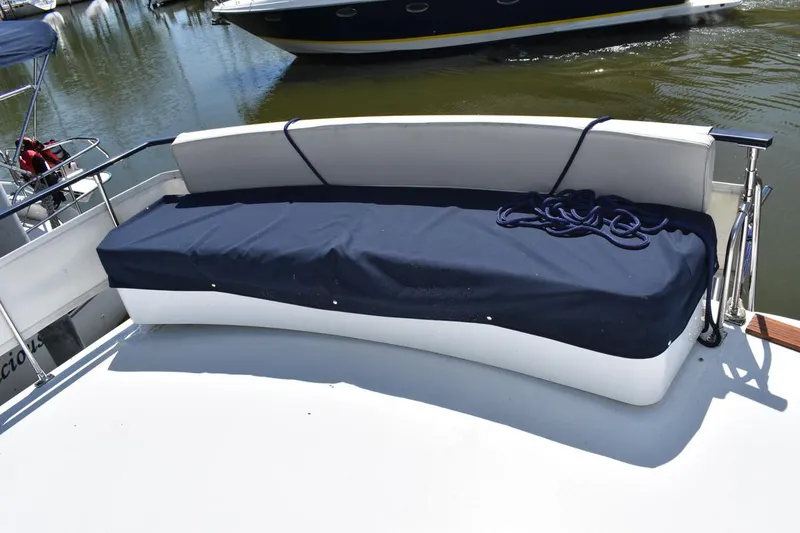 Slide: The Image of 1985 Marinette 39 Double Cabin boat with covered seating area on deck. - 18