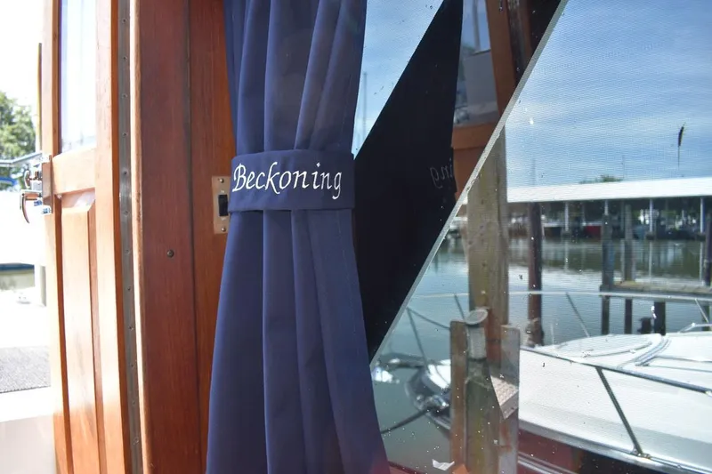 Slide: The Image of 1985 Marinette 39 Double Cabin with "Beckoning" curtain, docked at marina. - 37