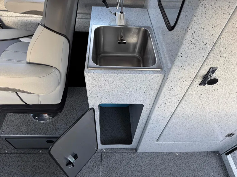 Slide: The Image of 2025 KingFisher 2825 Coastal Express interior with sink and seating. - 10