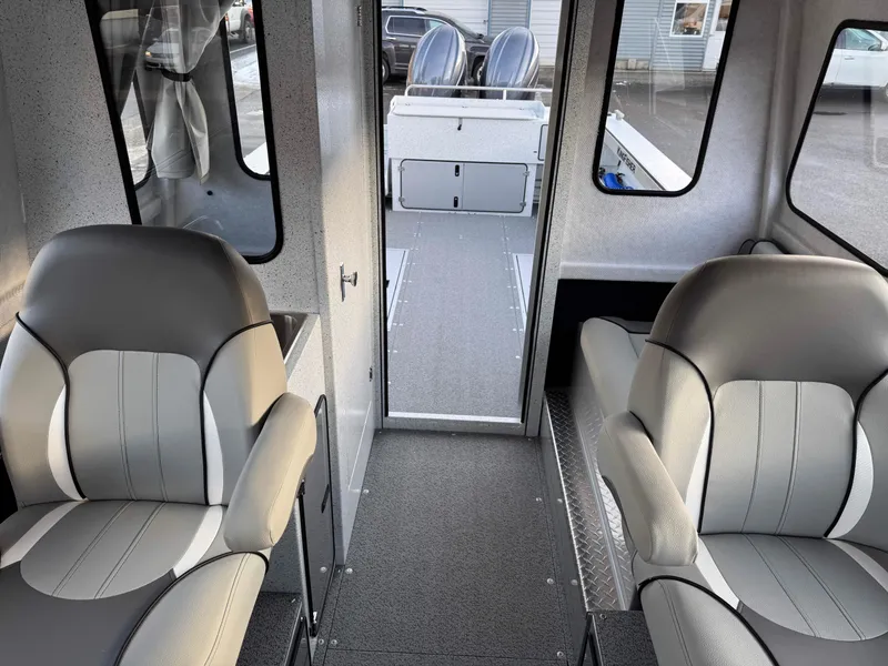 Slide: The Image of Interior of 2025 KingFisher 2825 Coastal Express boat with modern seating and spacious layout. - 12