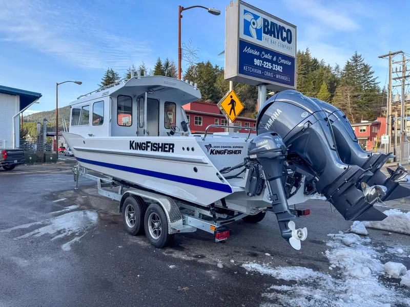 Slide: The Image of 2025 KingFisher 2825 Coastal Express boat on trailer, parked near Bayco Marine Sales. - 3