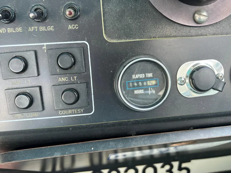 Slide: The Image of Control panel of a 1988 Wellcraft 3400 Grand Sport boat, showing elapsed time gauge. - 14