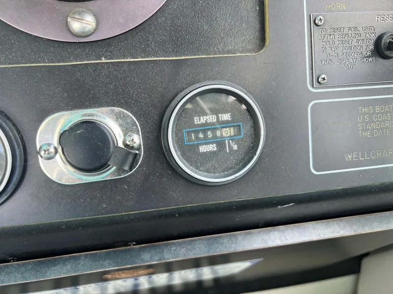Slide: The Image of Control panel of 1988 Wellcraft 3400 Grand Sport showing elapsed time of 4589 hours. - 15