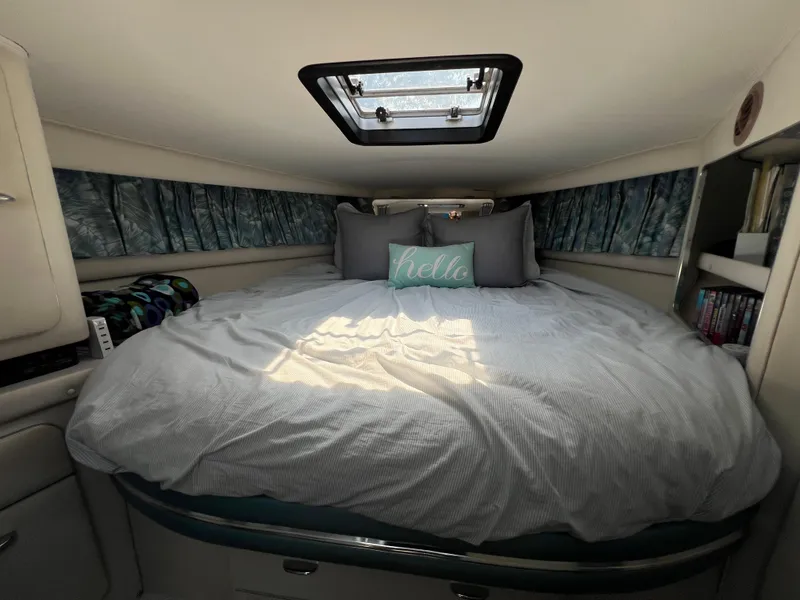 Slide: The Image of Cozy cabin interior of 1988 Wellcraft 3400 Grand Sport with skylight and decorative pillows. - 20