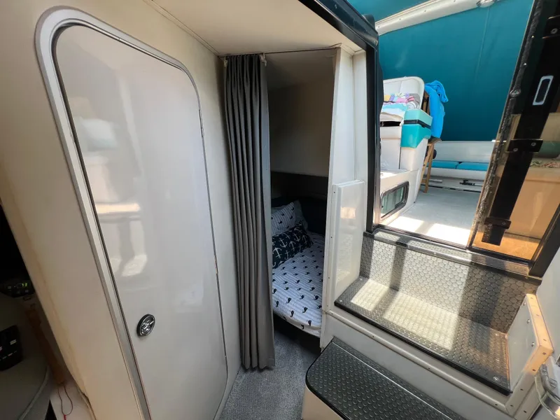 Slide: The Image of Interior of 1988 Wellcraft 3400 Grand Sport boat, featuring cozy cabin and modern design. - 22