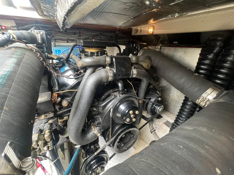 Slide: The Image of Engine compartment of a 1988 Wellcraft 3400 Grand Sport boat, showcasing mechanical components. - 30