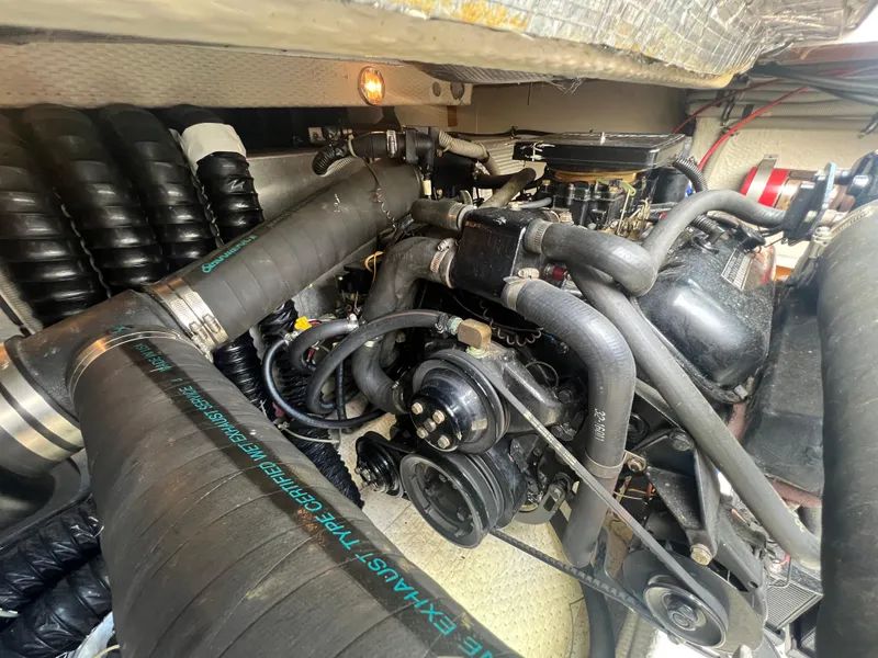 Slide: The Image of Engine compartment of a 1988 Wellcraft 3400 Grand Sport boat, showcasing mechanical components. - 31
