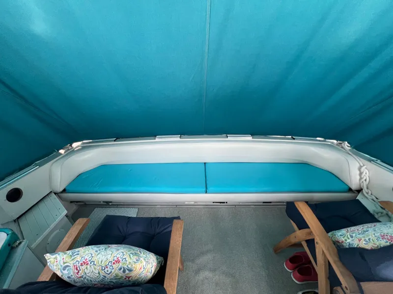 Slide: The Image of Interior of 1988 Wellcraft 3400 Grand Sport boat with blue seating and cushions. - 7