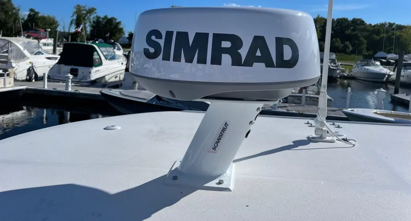Slide: The Image of Simrad radar on 2022 Sea Pro 239 Center Console boat at marina. - 10