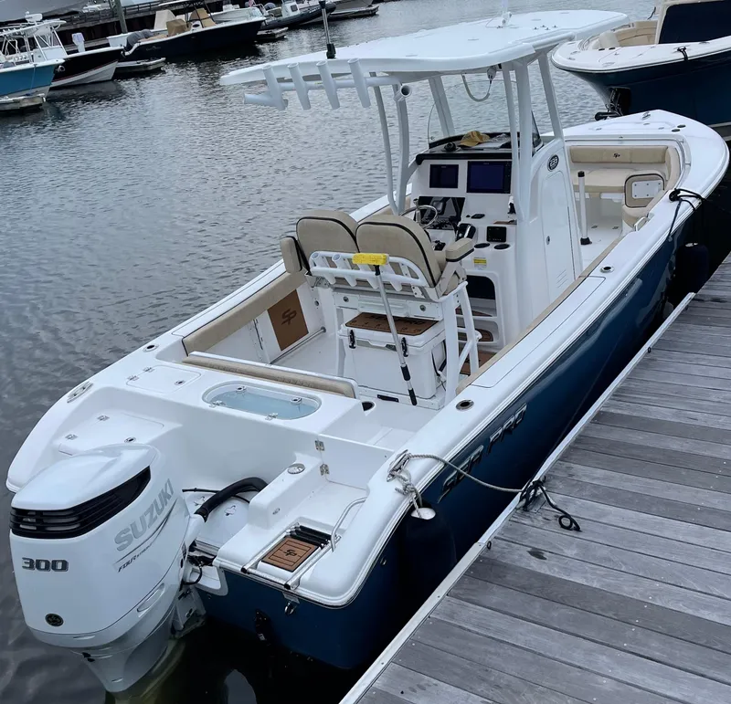 Slide: The Image of 2022 Sea Pro 239 Center Console boat docked with Suzuki 300 engine. - 7
