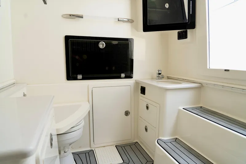 Slide: The Image of 2024 Cobia 350 boat interior with modern bathroom amenities and sleek design. - 15