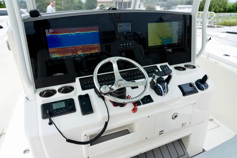 Slide: The Image of 2024 Cobia 350 boat dashboard with advanced navigation and control systems. - 6