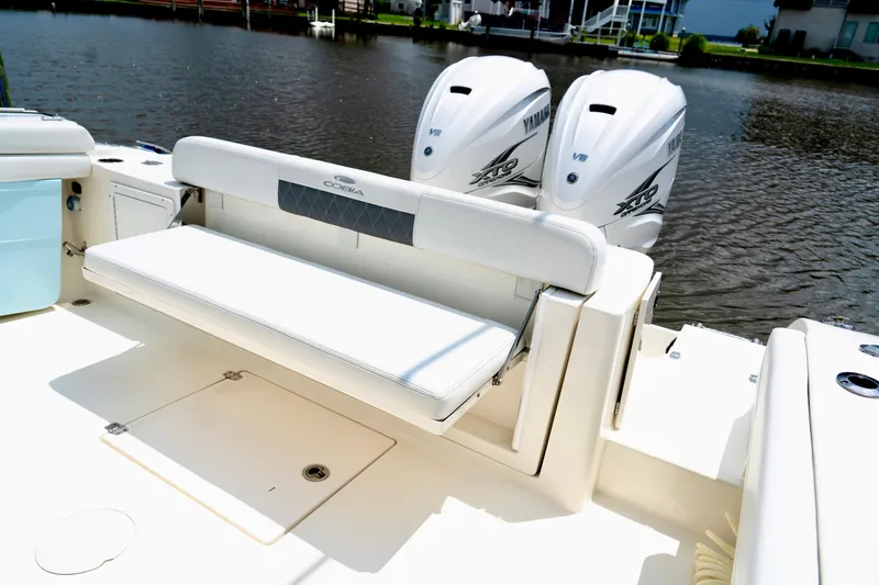 Slide: The Image of 2024 Cobia 350 boat with Yamaha engines, featuring a comfortable rear bench seat. - 9