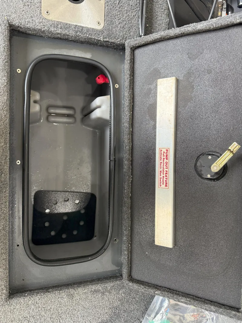 Slide: The Image of 2023 Ranger VS1682 WT boat compartment with open hatch and storage area. - 10