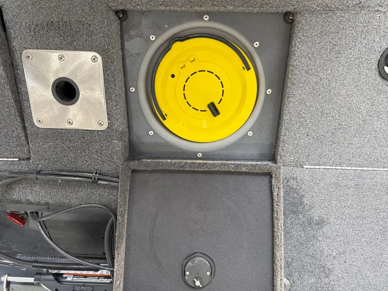 Slide: The Image of 2023 Ranger VS1682 WT boat deck with yellow hatch and metal fixture. - 11