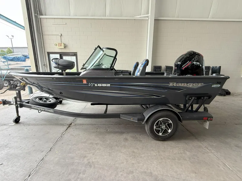 Slide: The Image of 2023 Ranger VS1682 WT boat on trailer in indoor setting. - 2