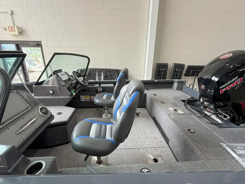 Slide: The Image of 2023 Ranger VS1682 WT boat interior with seating and Mercury engine. - 5