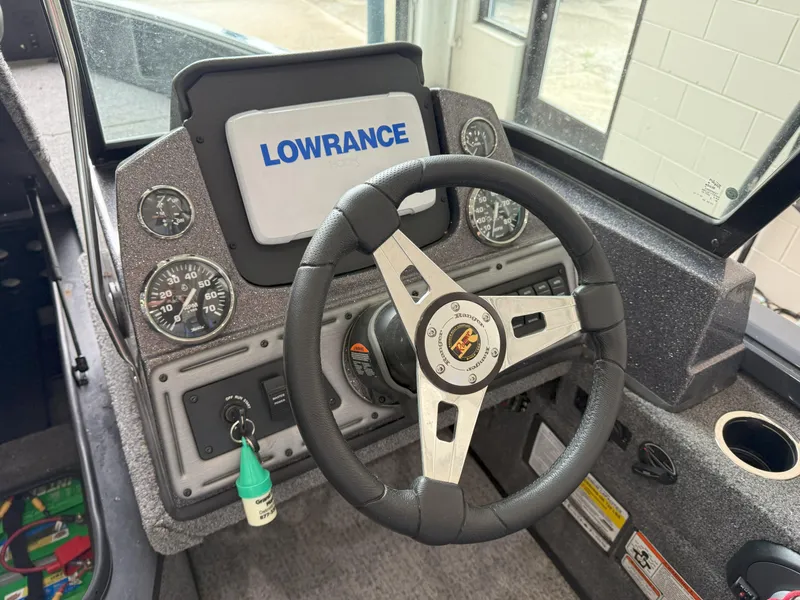 Slide: The Image of Steering wheel and dashboard of 2023 Ranger VS1682 WT boat with Lowrance display. - 7