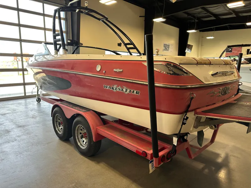 Slide: The Image of 2004 Malibu Wakesetter LSV boat on trailer in indoor showroom. - 3