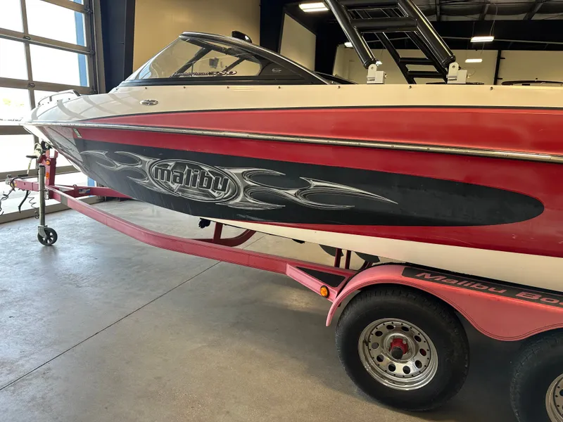 Slide: The Image of 2004 Malibu Wakesetter LSV boat on a trailer in a garage. - 4