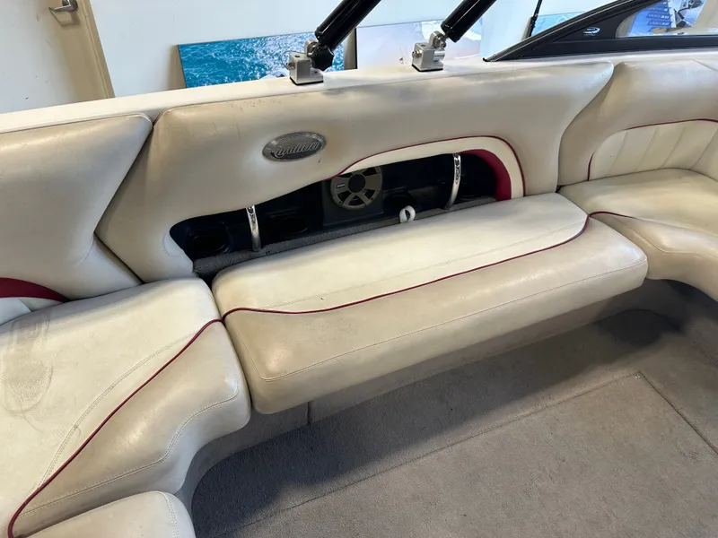 Slide: The Image of 2004 Malibu Wakesetter LSV interior with white leather seating and red accents. - 8