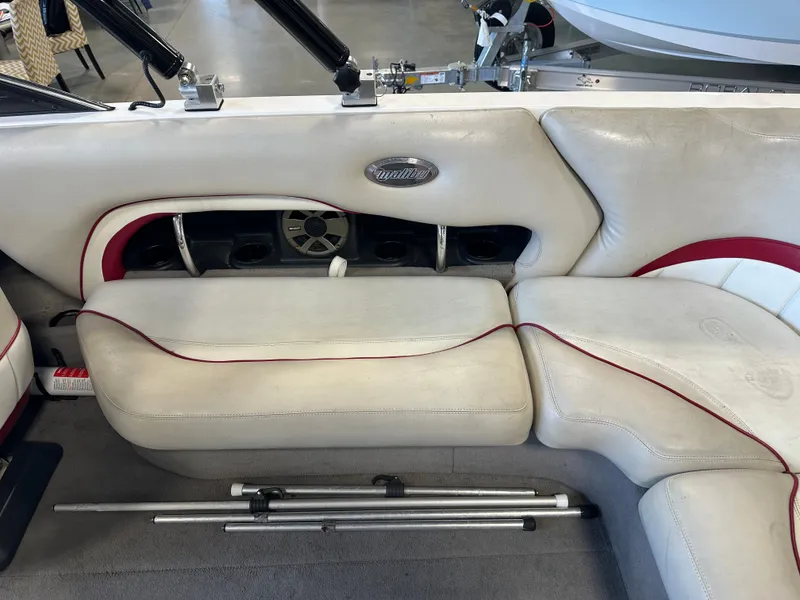 Slide: The Image of 2004 Malibu Wakesetter LSV interior with white leather seating and red accents. - 9