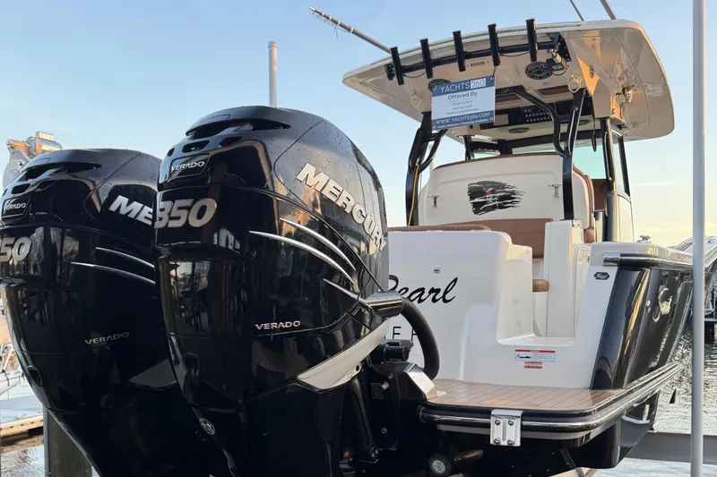 Slide: The Image of 2021 Scout 330 LXF boat with twin Mercury 350 Verado engines at dock. - 46